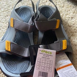 Brand new croc sandals. They are a men’s size 7